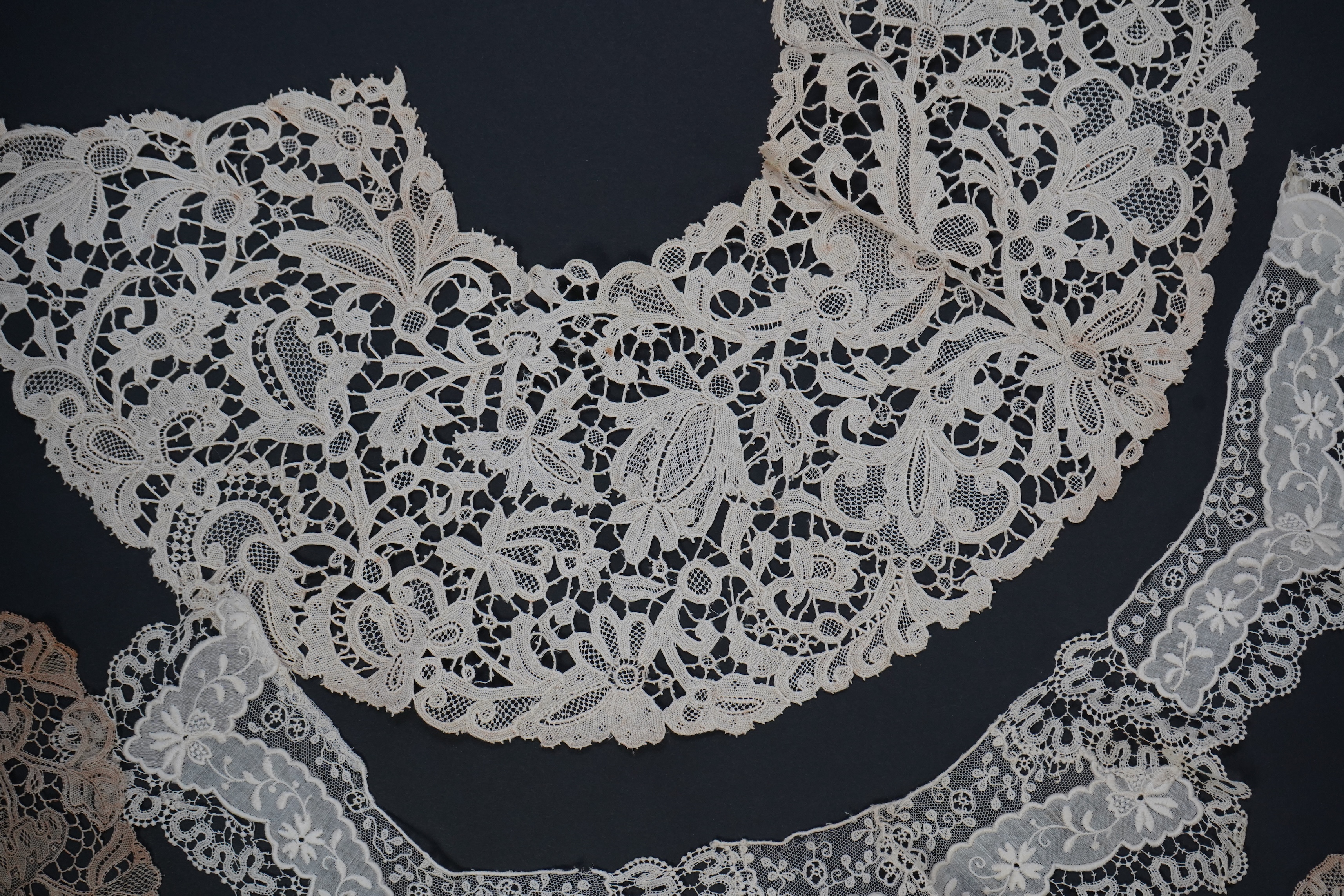 A variety of 19th and 20th century cream lace, being mixed hand and machine collars, lappets, trimmings together with a silk stole. Ideal for tv, film and theatre, stole 230 cm long. Condition - good